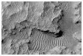 Layered Sedimentary Rocks of Floor of Large Crater