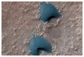 Putative Eroded Impact Melts of the Floor of Ritchey Crater