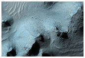 Pit in Crater with Bedrock Exposures