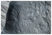 Distal Stratigraphy of Alba Patera Exposed in An Impact Crater
