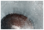 Fresh Sharp-Rimmed Crater of Northern Plains