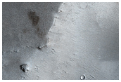 Small Very Recent Dark-Ejecta Crater