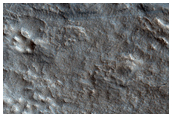 Relation of Lyot Crater Ejecta to Mesas of Deuteronilus Mensae