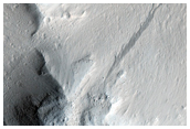 Layered Materials and Blocks in Olympus Mons Aureole