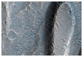 Faded Ray From Tomini Crater and Hebrus Valles Streamlined Islands