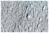 Smooth Deposits on the Northern Flank of Pavonis Mons