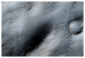 Crater Rim Near Chaotic Terrain in Memnonia Region