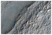 Light-Toned Surface in Rugged Terrain North of Icaria Planum