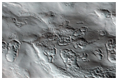 Marginal Ramparts within the Uppermost North Polar Layered Deposits