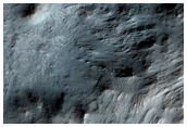 Layered Bedrock Exposed in Central Uplift of Crater in Thaumasia Planum