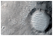Crater with Valleys Cut into Its Present Floor