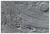 Flow-Banded Deformed Terrain of Hellas Basin Floor