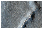 Valley Junction and Light-Toned Bedforms Seen in MOC Image M13-00983