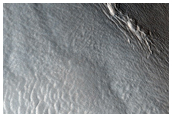 Relation of Lyot Crater Ejecta to Mesas of Deuteronilus Mensae