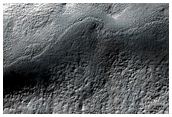 Dissected Mantle Terrain and Flow Feature in Noachis Terra