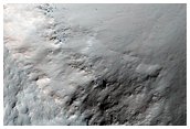Sinuous Channels with Rocky Floor