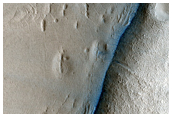 Aligned Pits in Fretted Terrain