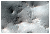 Ponded Materials and Central Pit-Peak of Unnamed Crater Near Denning Crater
