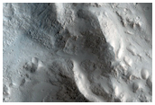 Streamlined Features in Ponded Materials of Unnamed Crater in Alba Patera