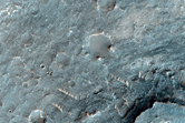 Valley Juncture Along Plains West of Ganges Chasma with Light-Toned Deposit