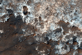 Light-Toned Outcrops Near Crater Rim in Arabia Terra