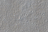 Crater with Impressive Wind Streak in Elysium Planitia