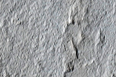 Interaction between Unnamed Crater Ejecta and Pre-Existing Terrain