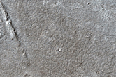Lava Flow Front and Many Zunil Crater Secondaries on Two Terrains