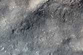 Distant Flow Lobe from Young 40-Kilometer Crater Near Tartarus Montes