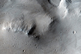 Smooth Crater Floor with Bounding Terrace on Flank of Uranius Mons
