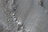 Contact between Fractured Plains and Lobate Lava Flows