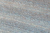 Layered Deposits and Unconformities in Western Gemini Scopuli