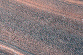 Layered Deposits and Unconformities in Western Gemini Scopuli