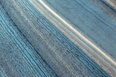 Gemini Lingula Scarp with Outcrop of Layered Deposits and Unconformities