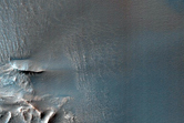 Wind Streaks and Unusual Dark Dunes in Ius Chasma
