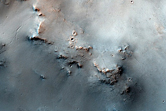 Dark Cracked Mantle Material Seen in MOC Images M00-01078 and E05-01874