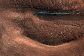 Possible Seasonal Process in the Gemini Scopuli Layered Deposits
