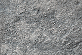 Olivine-Rich Deposits on the Floor of Peta Crater