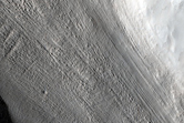Tributary Glacier-Like Feature with Parallel Lineations on Valley Wall