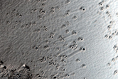 Depressions on Floor of Collapse Feature Northwest of Arsia Mons