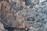 Exhumed Impact Crater in Layered Deposits