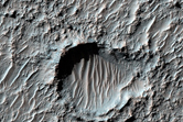 Arcuate High Thermal Inertia Region in Magelhaens Crater