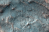 Flow Ejecta From Large Crater in Northeast Hellas Region