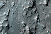 Knobs, Bright Deposits, and Inverted Channels in Eberswalde Crater