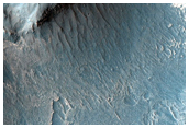 Valley Features and Light-Toned Deposits along Melas Region Southern Wall