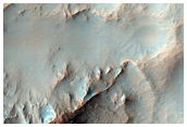 Light-Toned Bedrock Exposed in Walls and Central Peak of Crater
