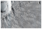 Recent Impact Crater Through Medusae Fossae Formation and Flood Lavas