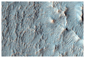 Valley Sourced from Clay-Bearing Crater Fill