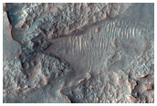 Light-Toned Materials Eroding from Ponded Materials in Kontum Crater