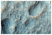 Very Fresh Small Crater on Floor of a Large Crater Rich in Kaolinite